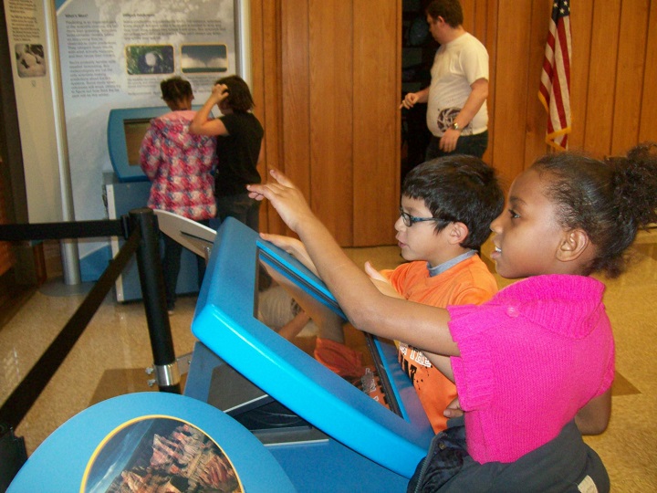 kids looking at a museum exhibit