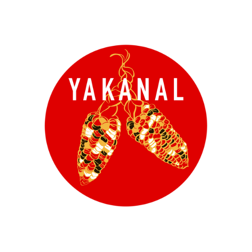 Image is a red circle with an illustration of two corn cobs in red, green, white, and yellow. The word "YAKANAL" is displayed in white in all uppercase at the top.